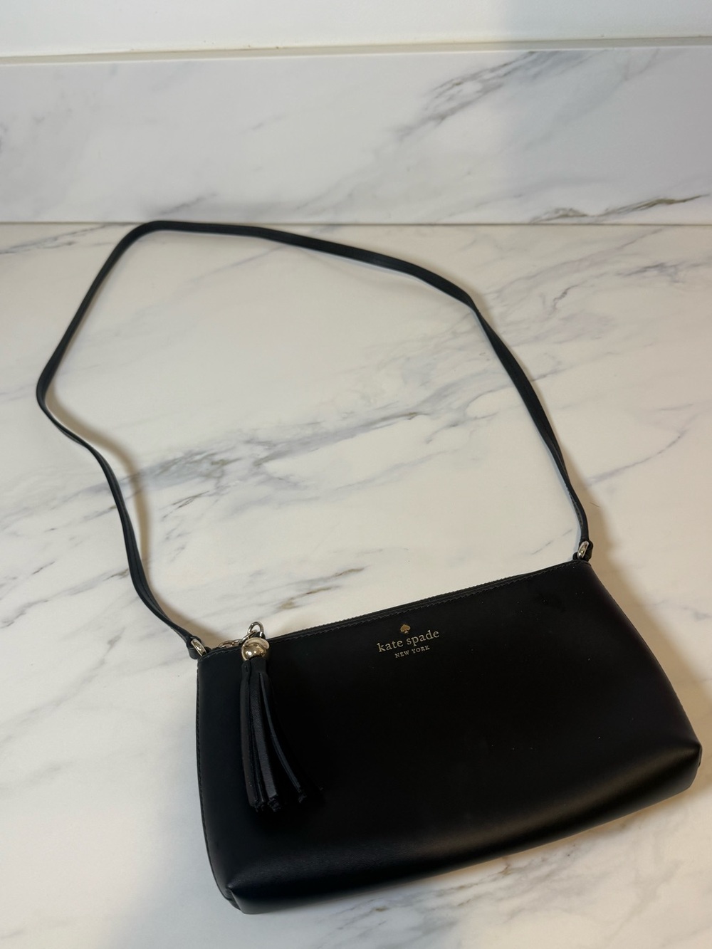 Kate spade black leather crossbody with tassel